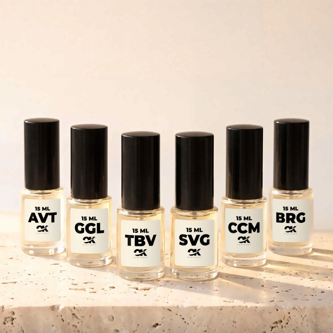 Pack de 6 perfumes de 15 mL de OK Perfumes: AVT, GGL, TBV, SVG, CCM y BRG sobre travertino